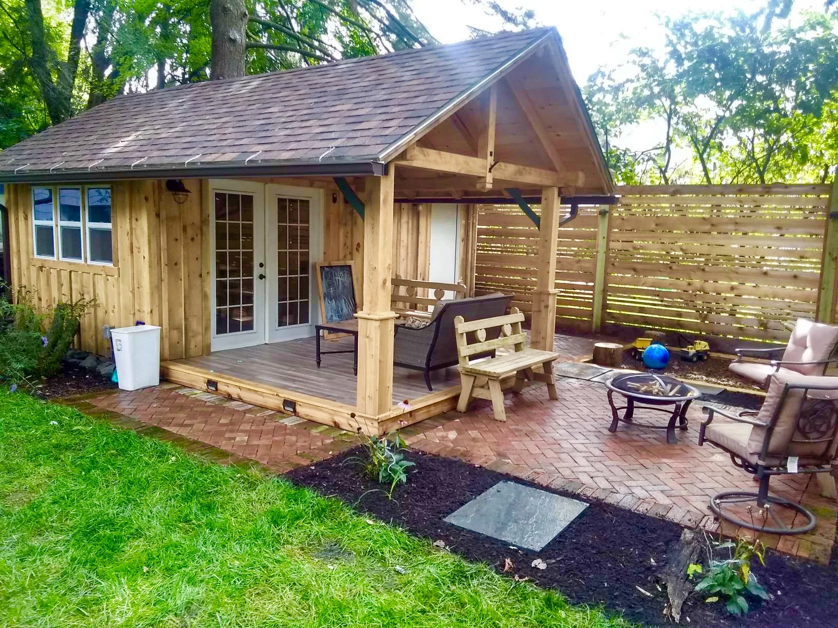 Outdoor Entertainment Area with Brick Patio & Fence - Ithaca NY