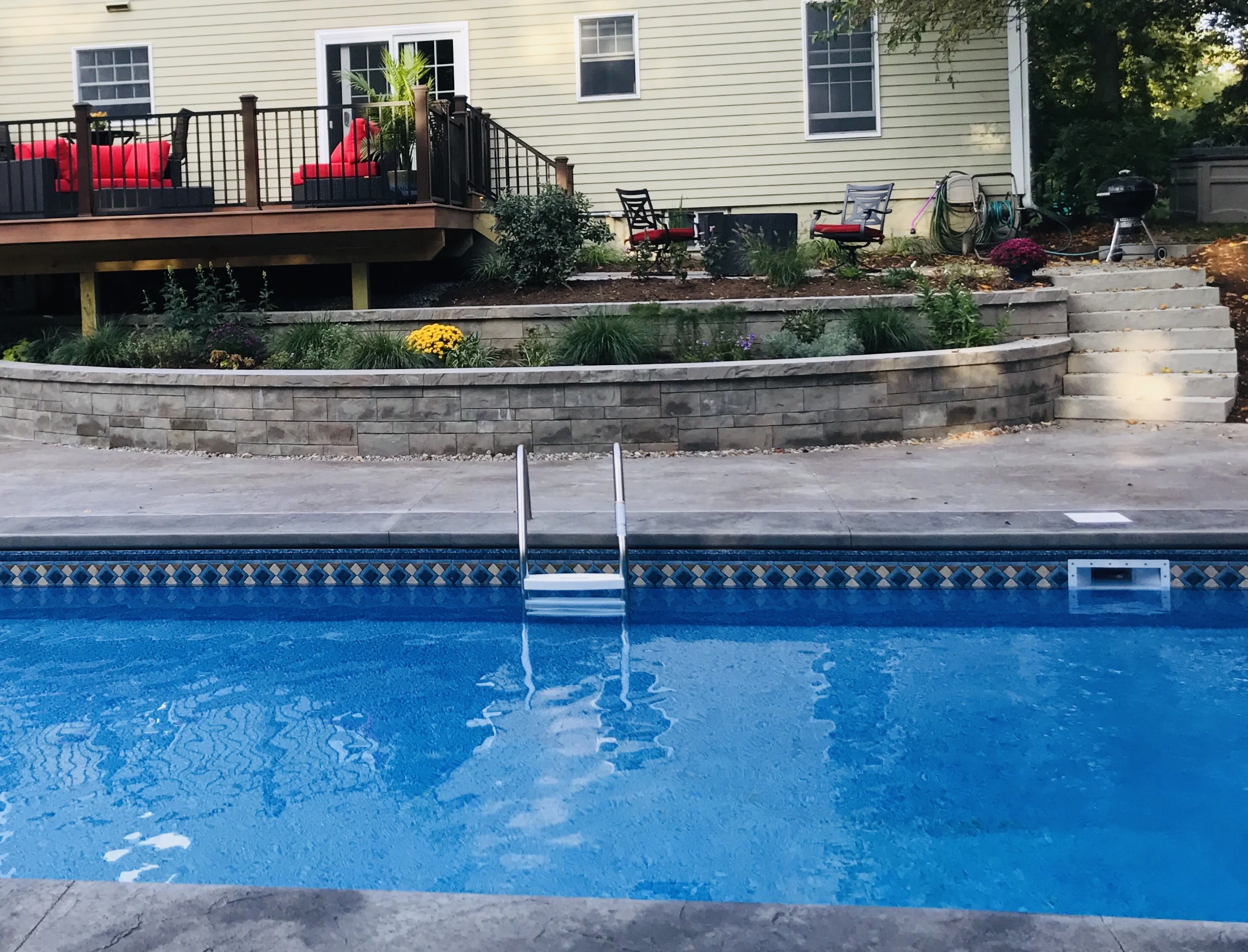 Techobloc Retaining Wall Installation with Stampcrete Patio