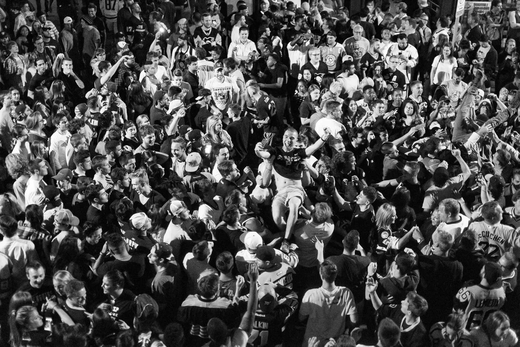 Fans celebrate the Pittsburgh Penguins victory over the San Jose Sharks in the Stanely Cup Finals by storming into the streets of Pittsburgh's South Side neighborhood on June 12, 2016. Later, the streets would be cleared by Pittsburgh police officers in full riot gear, inclduing a contingent mounted on horseback.