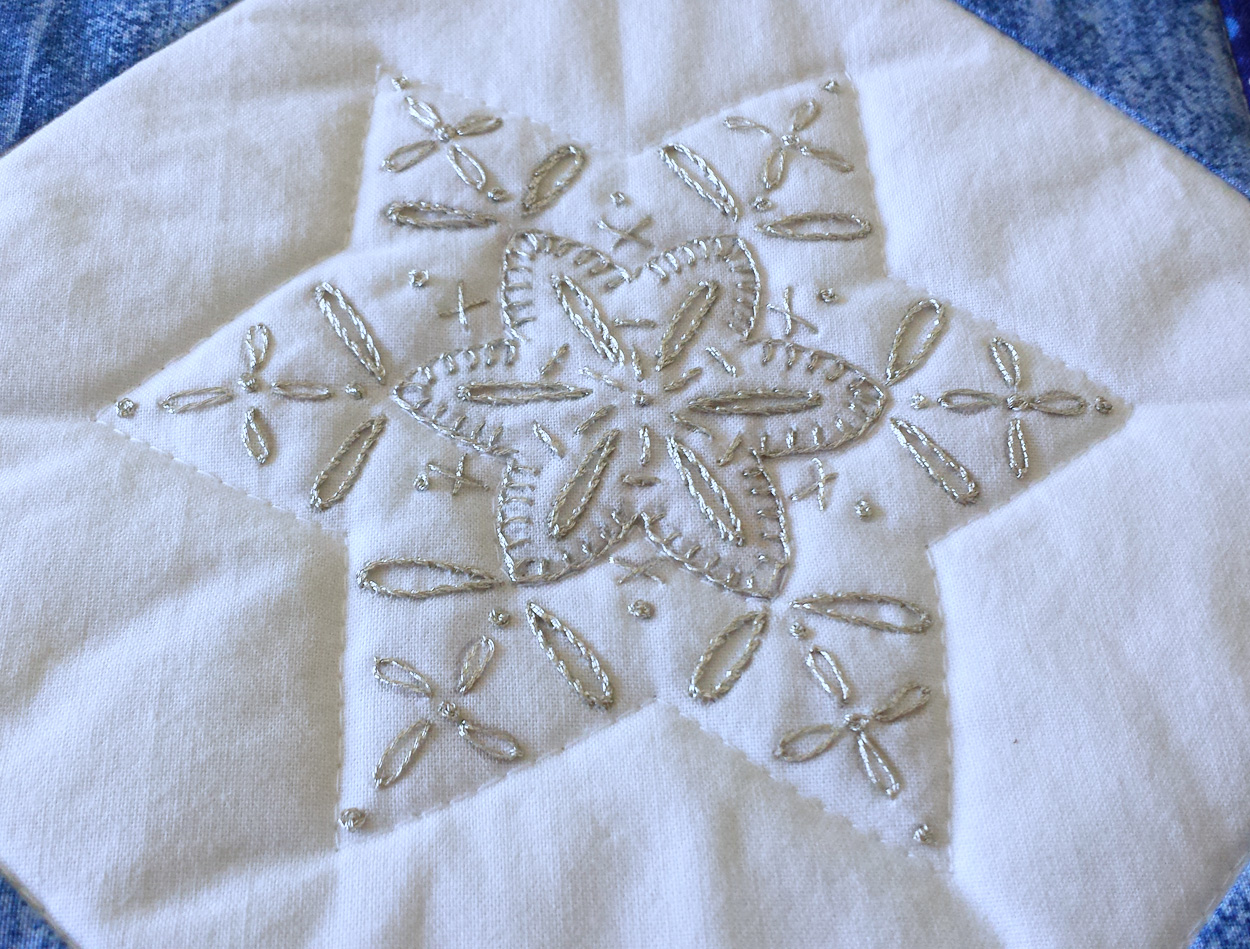 This snowflake was stitched using Cosmo Nishikiito #23