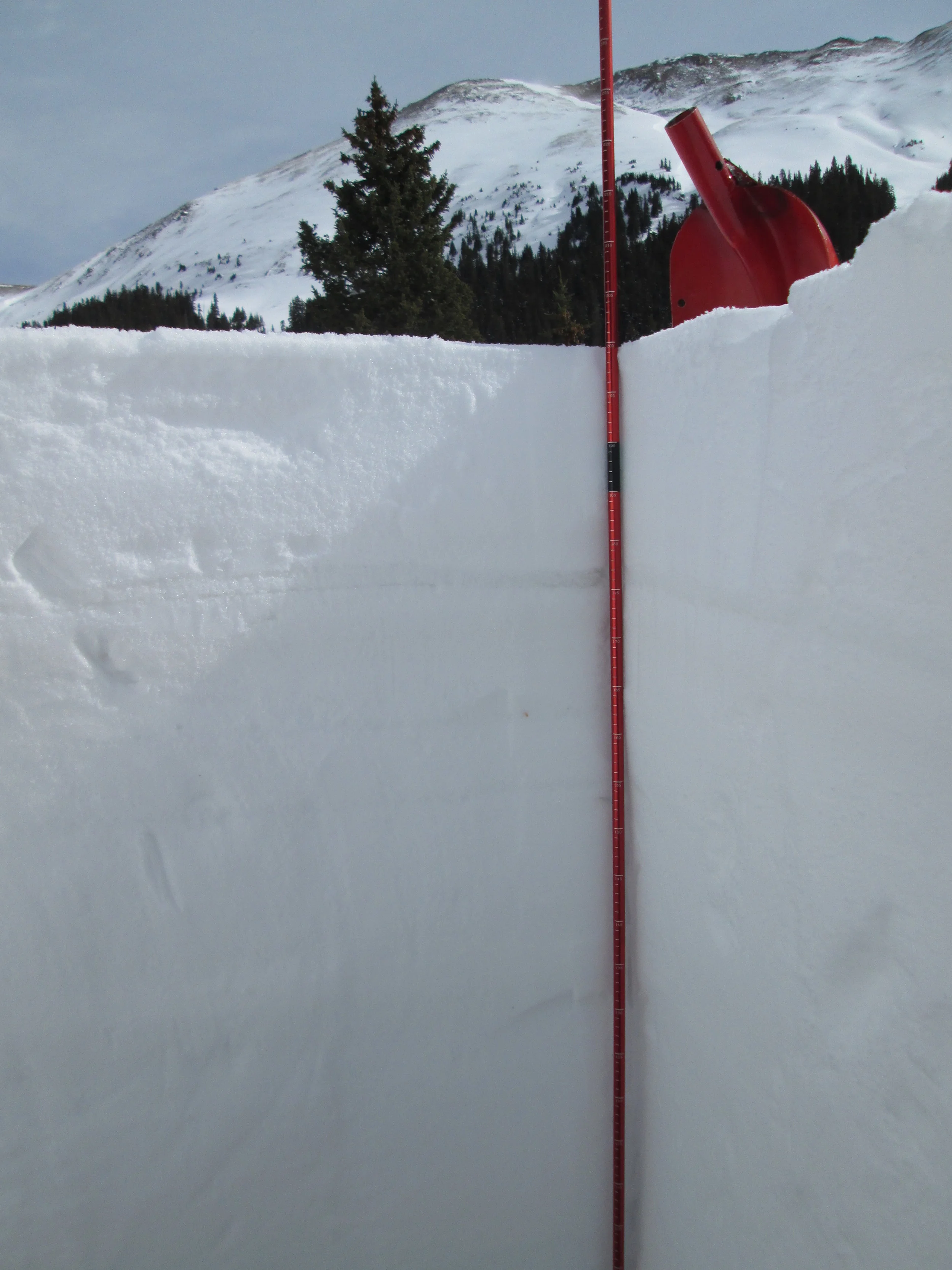 On the morning of Sunday, March 30, dust layer D3-WY2014 was faintly visible in a diffuse band 8-10” below the snow surface. Dust layer D2 was also weakly present in another diffuse band just below a melt-freeze (polycrystal) crust underlying D3. Later that evening, dust layer D4 (March 30) fell onto the clean snow surface seen in this profile, with minimal fresh snow covering the new dust. Perhaps within hours the next day, D4 may have been extensively exposed and significantly reducing snow albedo until fresh snowfall beginning April 2 began to bury D4. Solar energy absorbed by layer D4 will need to melt about 1” of SWE before merging with layer D3, reducing snow albedo even further. During and after that merging process, melt water percolating downward from the dirty snow surface will hasten the warming of the snowpack toward isothermal.