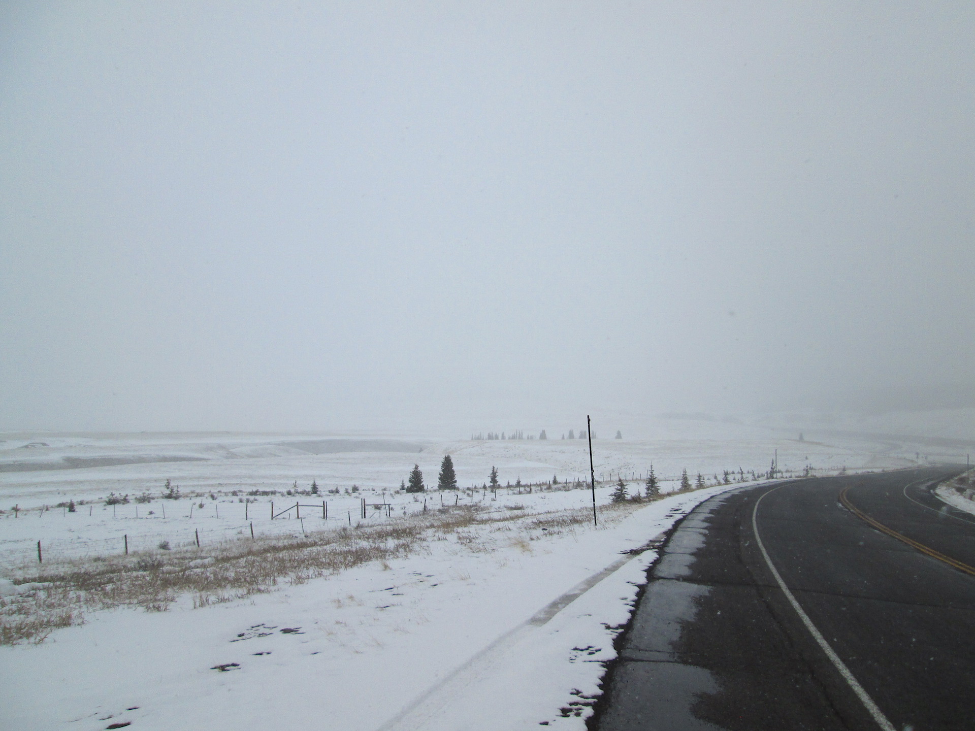 Looking north at North Clear Creek Park from Hwy 149 showing what had been snow-free ground, prior to the snowfall in progress. 