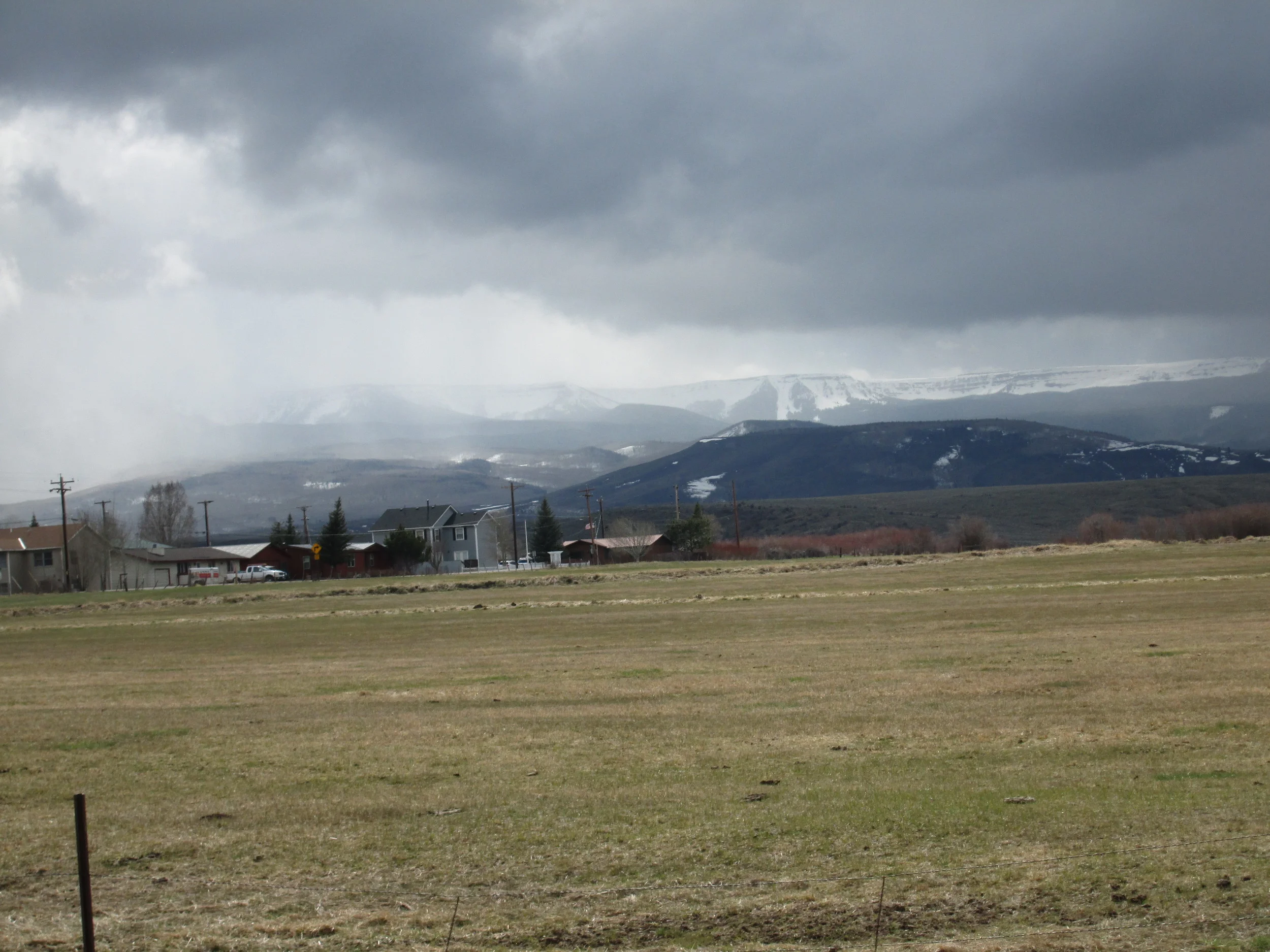 The Flat Tops eastern rim, seen behind the town of Yampa, was well covered in snow, while the valley floor was snow free and beginning to green. 
