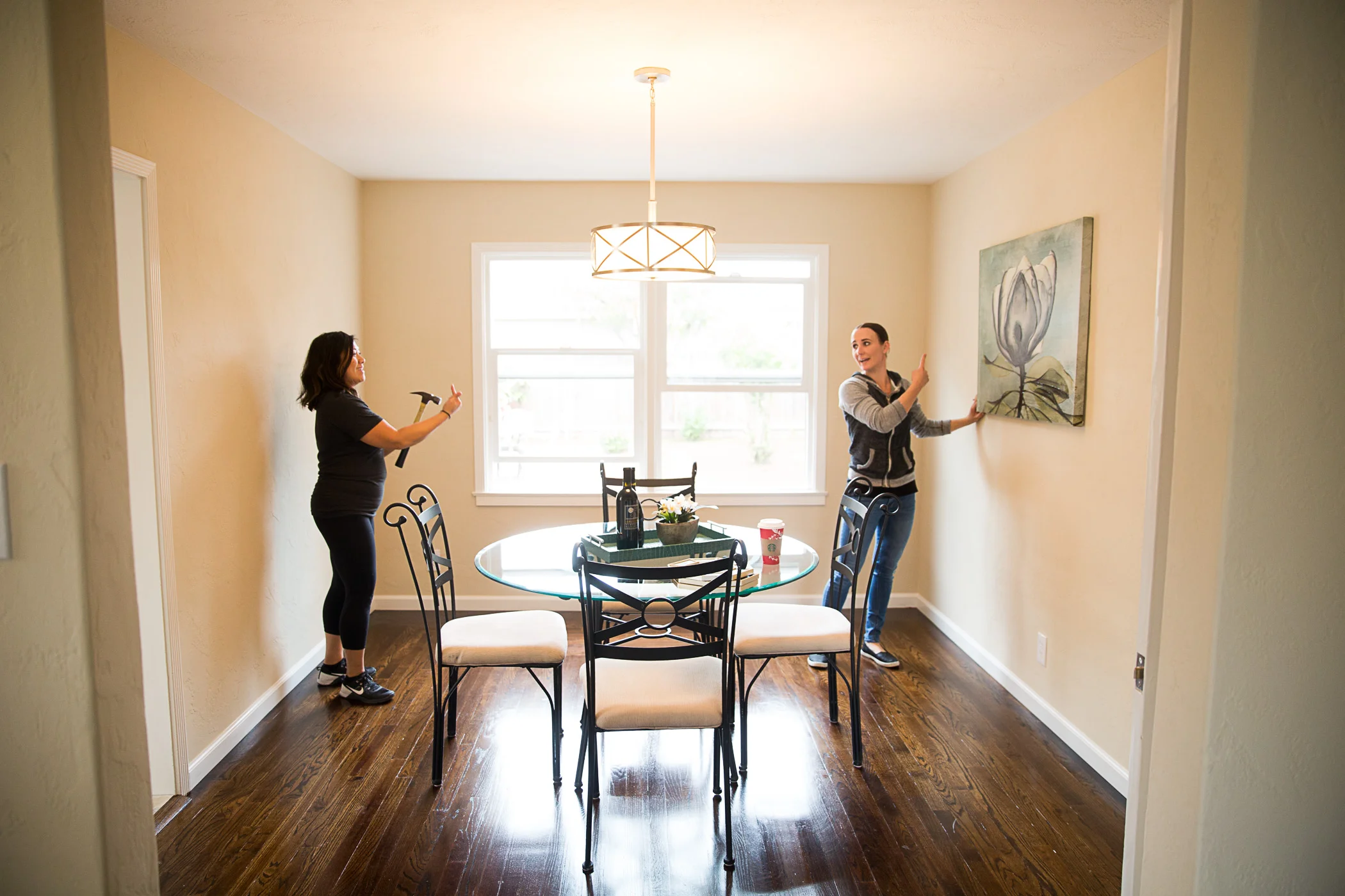 The professional stagers put the finishing touches on the home.