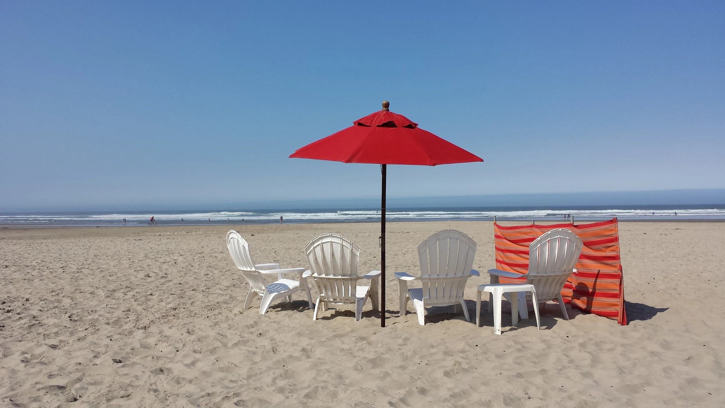 Our beach set-up, complete with a windbreaker, arranged by the cabana team at the Surfsand Resort {where we stayed}. &nbsp;