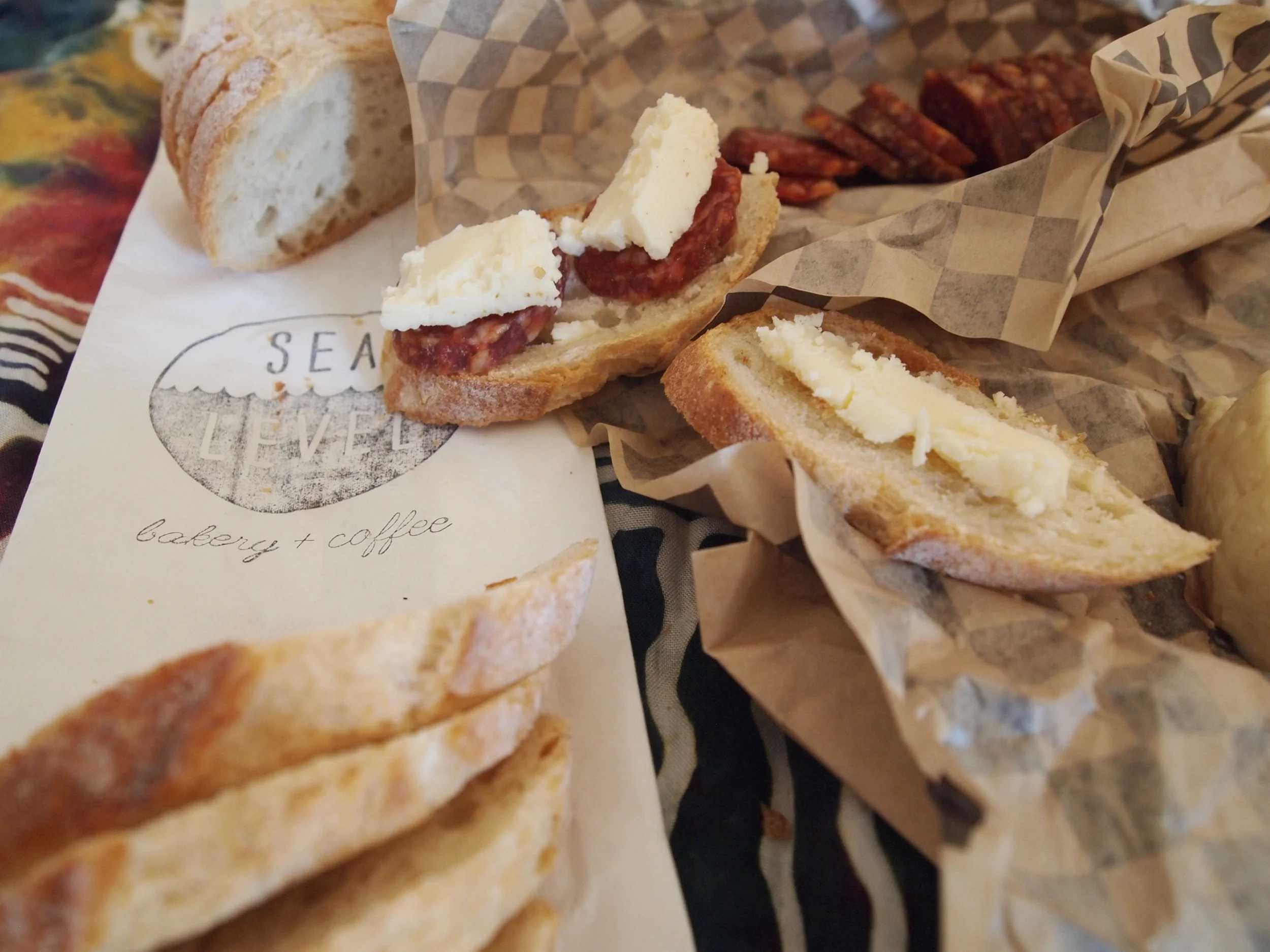 Picnic from EVOO Cannon Beach's take-away shop featuring local cheese and meats, plus bread from Sea Level Bakery.