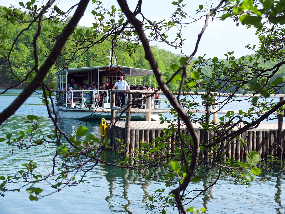 Electric boats shuttle visitors across the park's largest lake.