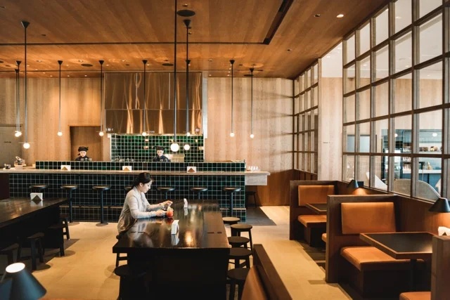Jade-hued ceramic tiles and black harvest tables set the tone for the lounge's designer dining.&nbsp;&nbsp;&nbsp;