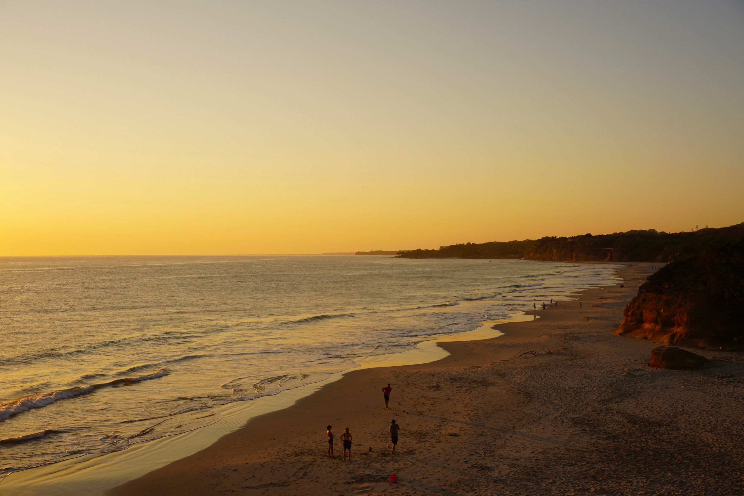 Golden hour view of Playa Las Destiladeras. The amount of people you see in this shot was part of this beach's perfection: Busy enough so you're not worried about safety, yet deserted enough that you have space and serenity. 