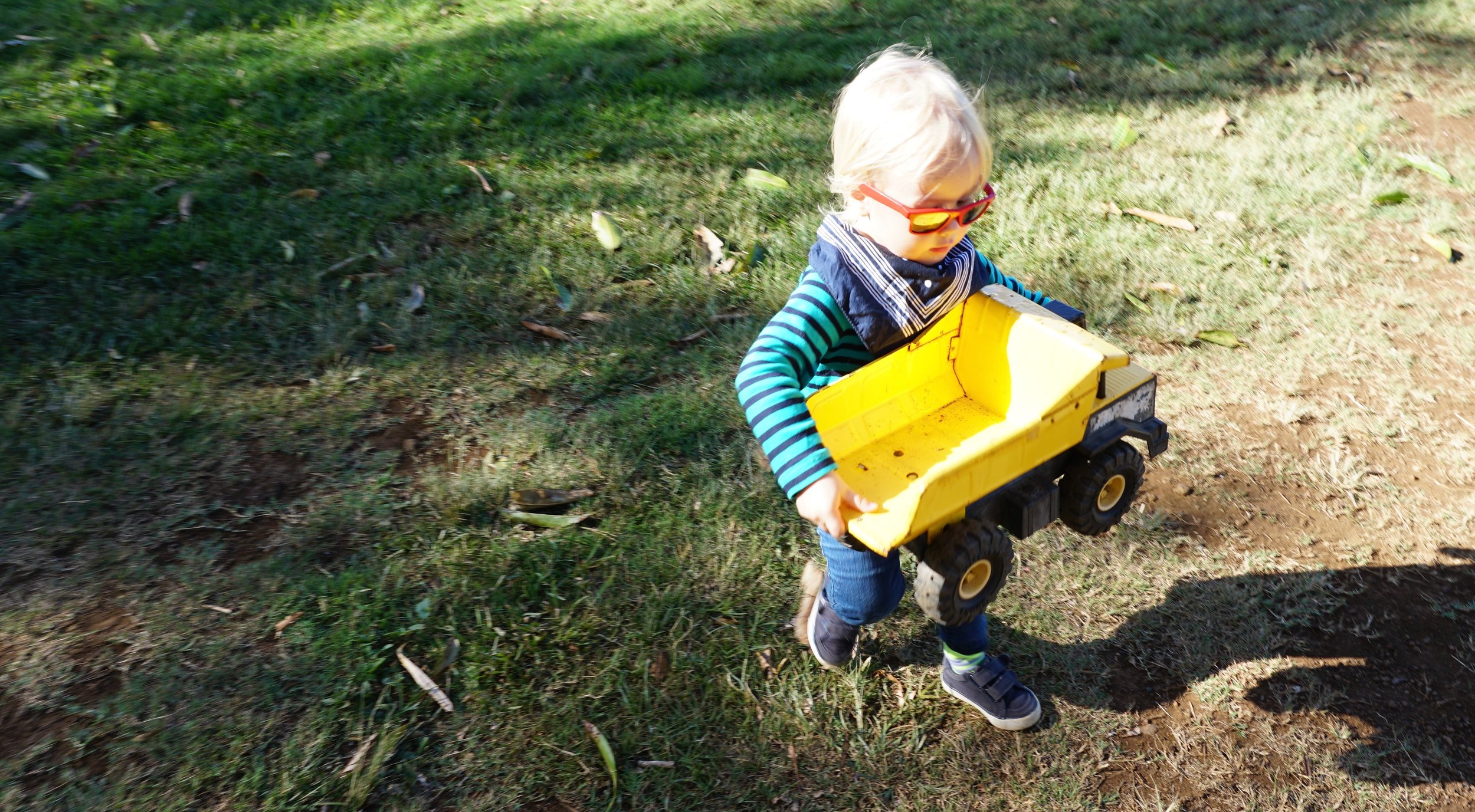 Blue Styler playing with a vintage Tonka dump truck {Mr. Trip Styler used to have one...!} from the Toy Box