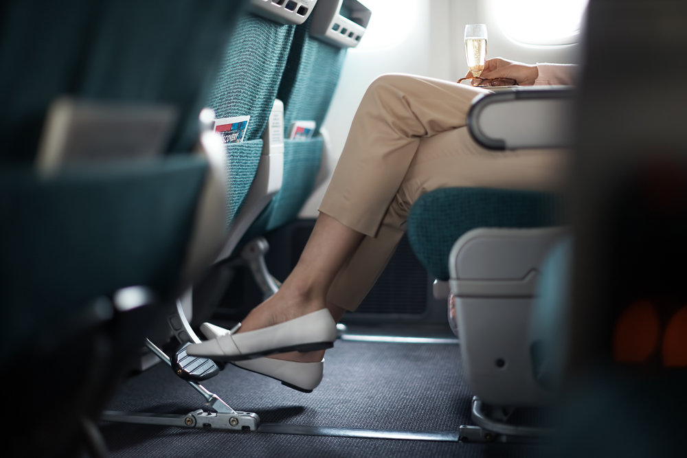  With multiposition headrests for snoozing and ample legroom, even Economy is a well-curated experience aboard Cathay. 