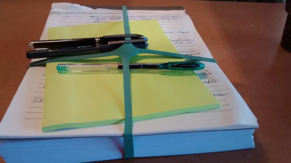 A work-in-progress: my first draft manuscript, my list of revision notes, and pens and Post-Its to put it all in order.
