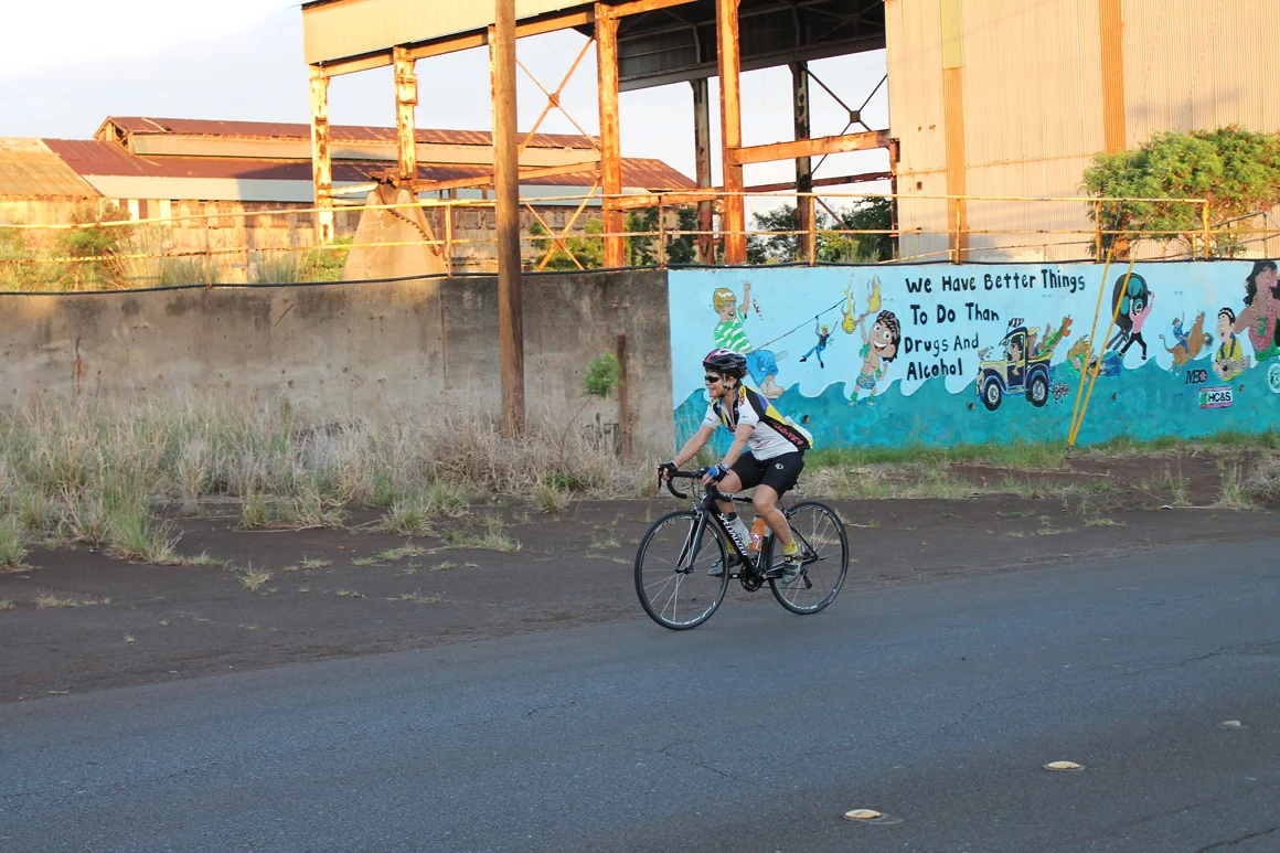 Ellen rides past the old sugar mill at Paia. Even here, the grade was about 4-5 percent.