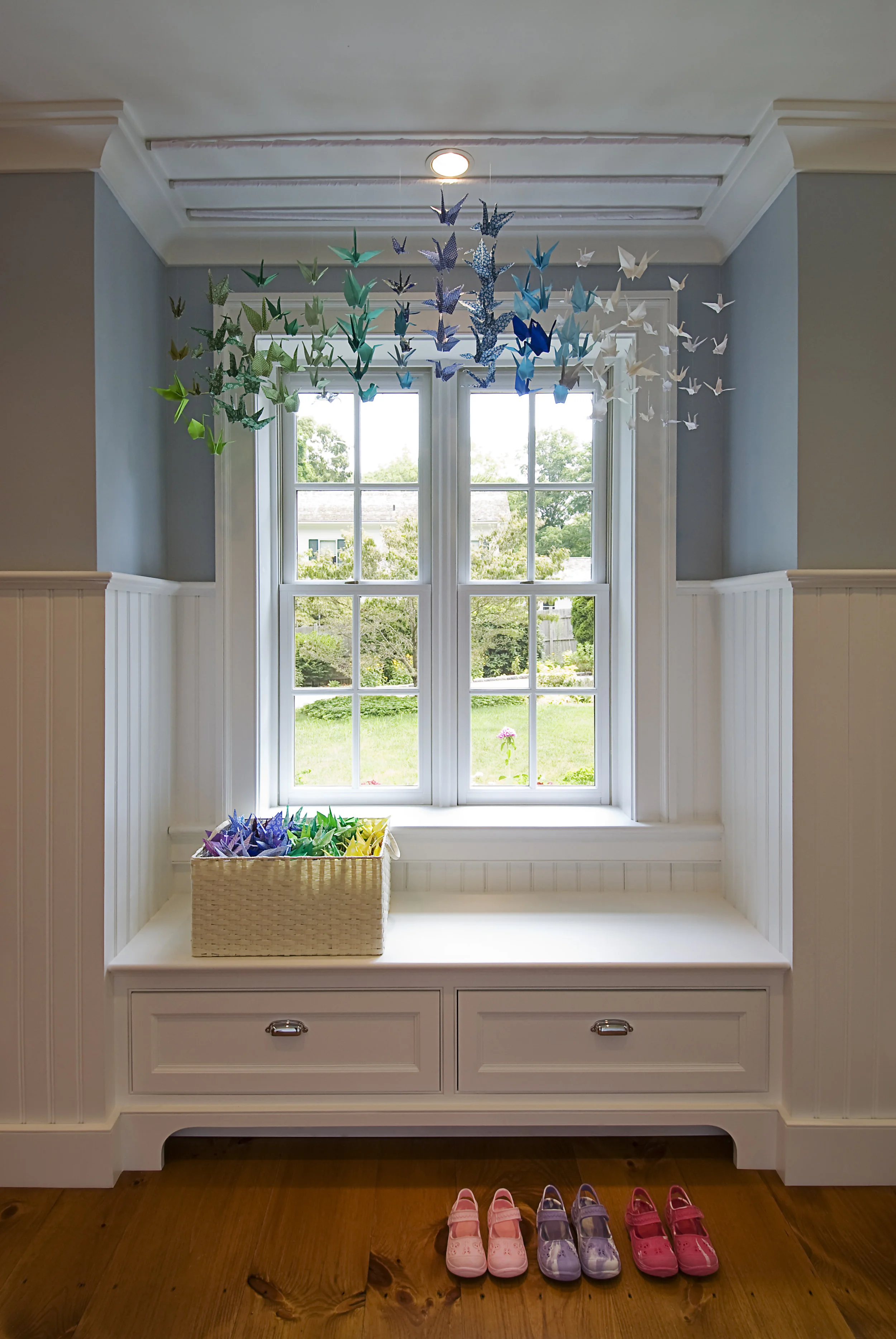 Window seats add comfort and charm to a small hall.
