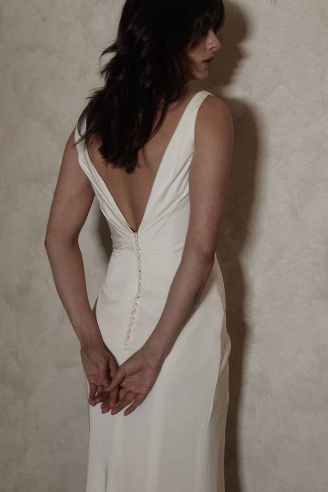 Australian wedding dress with low back and buttons in crepe.jpg