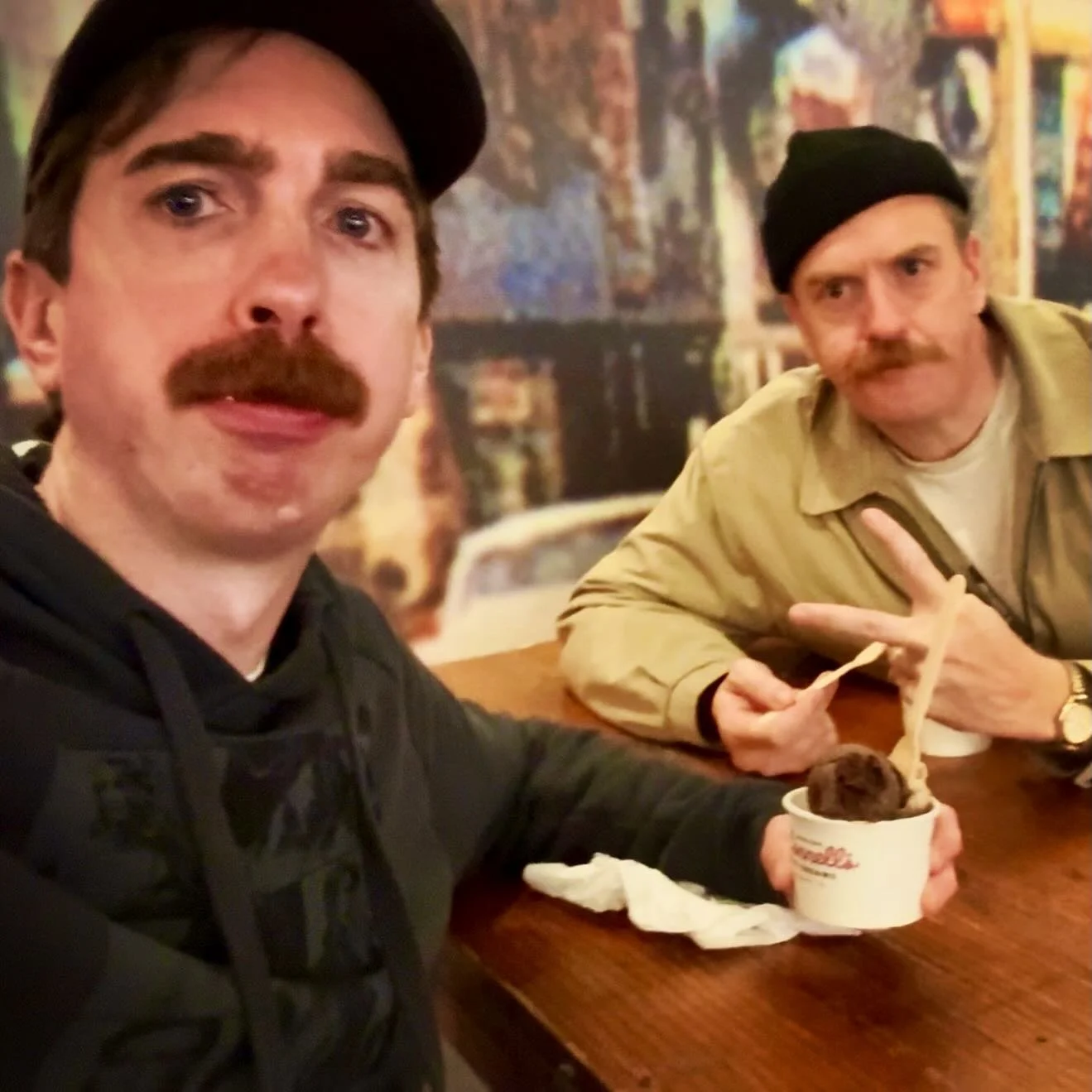 2 normal men having ice cream.