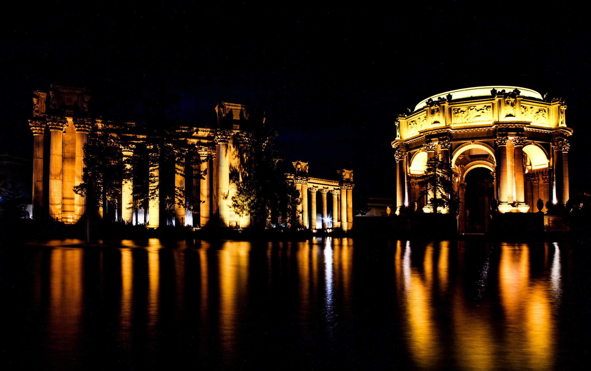 The Palace of Fine Arts in the Marina District of San Francisco, California , is a monumental structure originally constructed for the 1915 Panama-Pacific Exposition in order to exhibit works of art presented there. One of only a few surviving structures from the Exposition, it is still situated on its original site. It was rebuilt in 1965, and renovation of the lagoon, walkways, and a seismic retrofit were completed in early 2009. In addition to hosting art exhibitions, it remains a popular attraction for tourists and locals, and is a favorite location for weddings and wedding party photographs for couples throughout the San Francisco Bay Area , and such an icon that a miniature replica of it was built in Disney's California Adventure in Anaheim . [