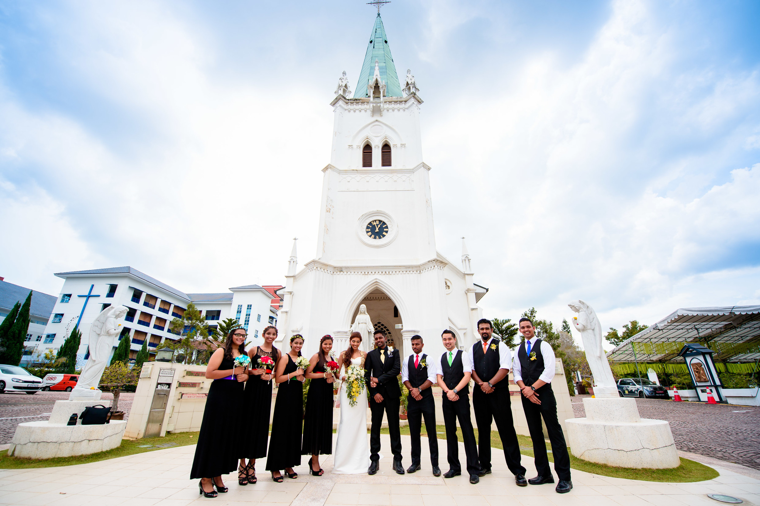 church wedding couple with bestmen & bridesmaids