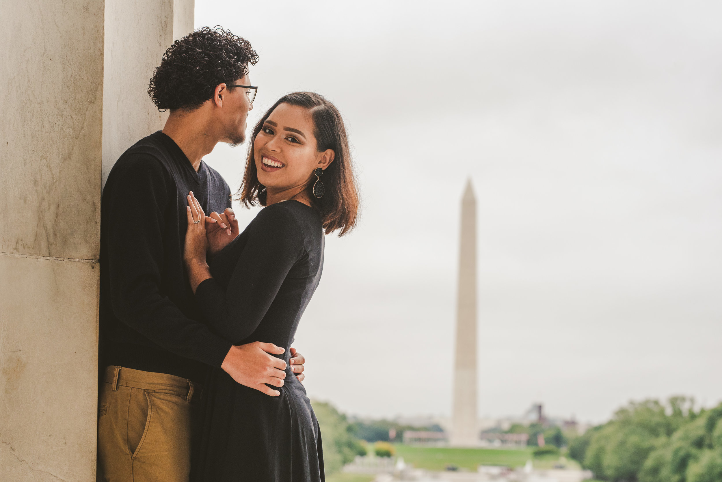 A Couple happy in front of the Washington D.C Monument