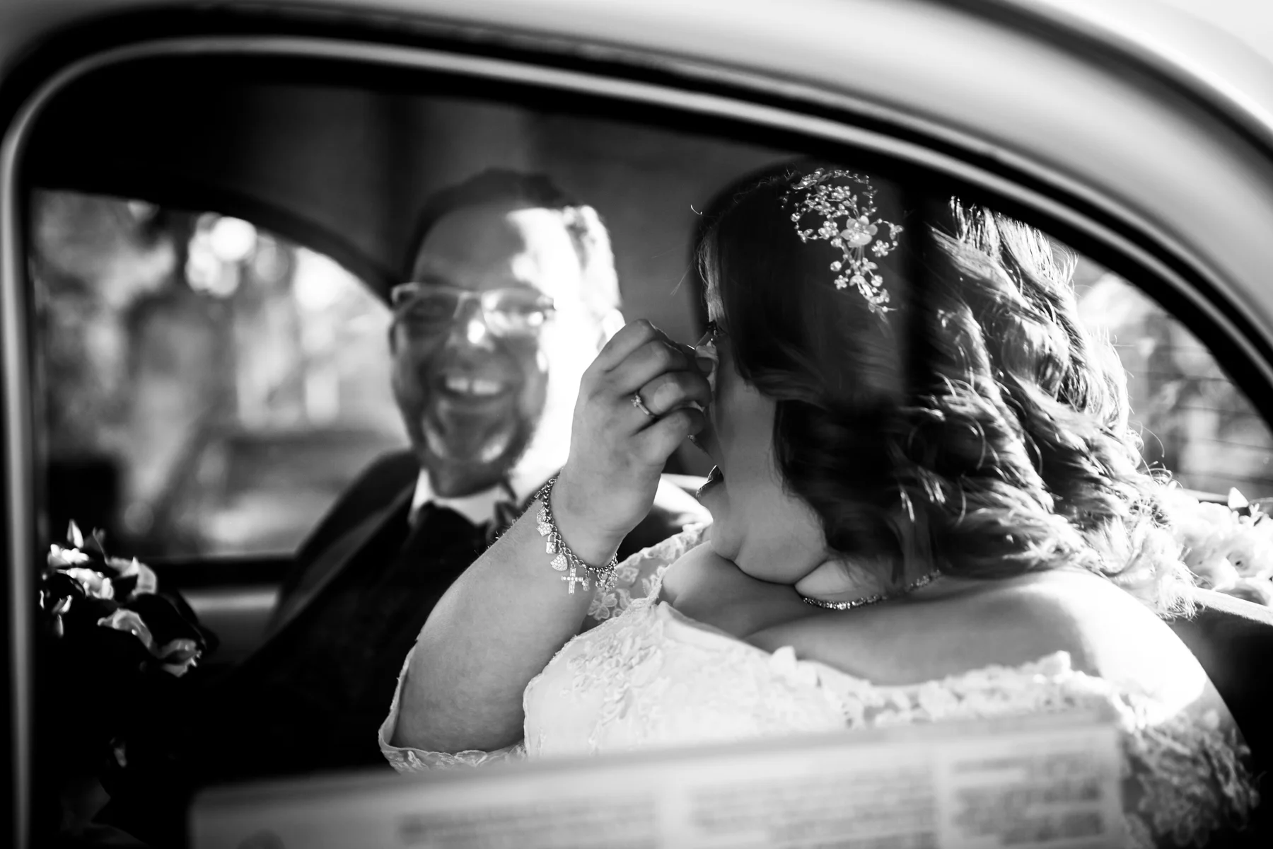 A Teary Bride with a Proud Father Beside Her