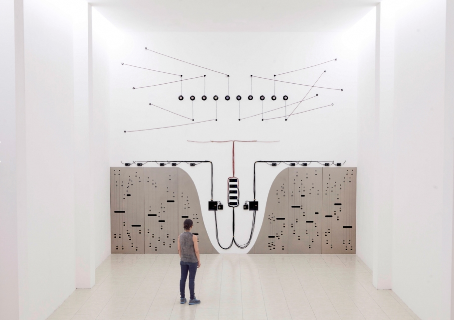 Naama Tsabar Propagation (Opus 3), 2015 Wood, speakers, amplifiers, mixers, wires, cables, piano strings, bone, cable holders, contact microphones, brass, sheet rock. 6.5 meters high x 6.8 meters wide. MARTE- Contemporary, El Salvador Photo by Rodrigo Dada Courtesy of artist