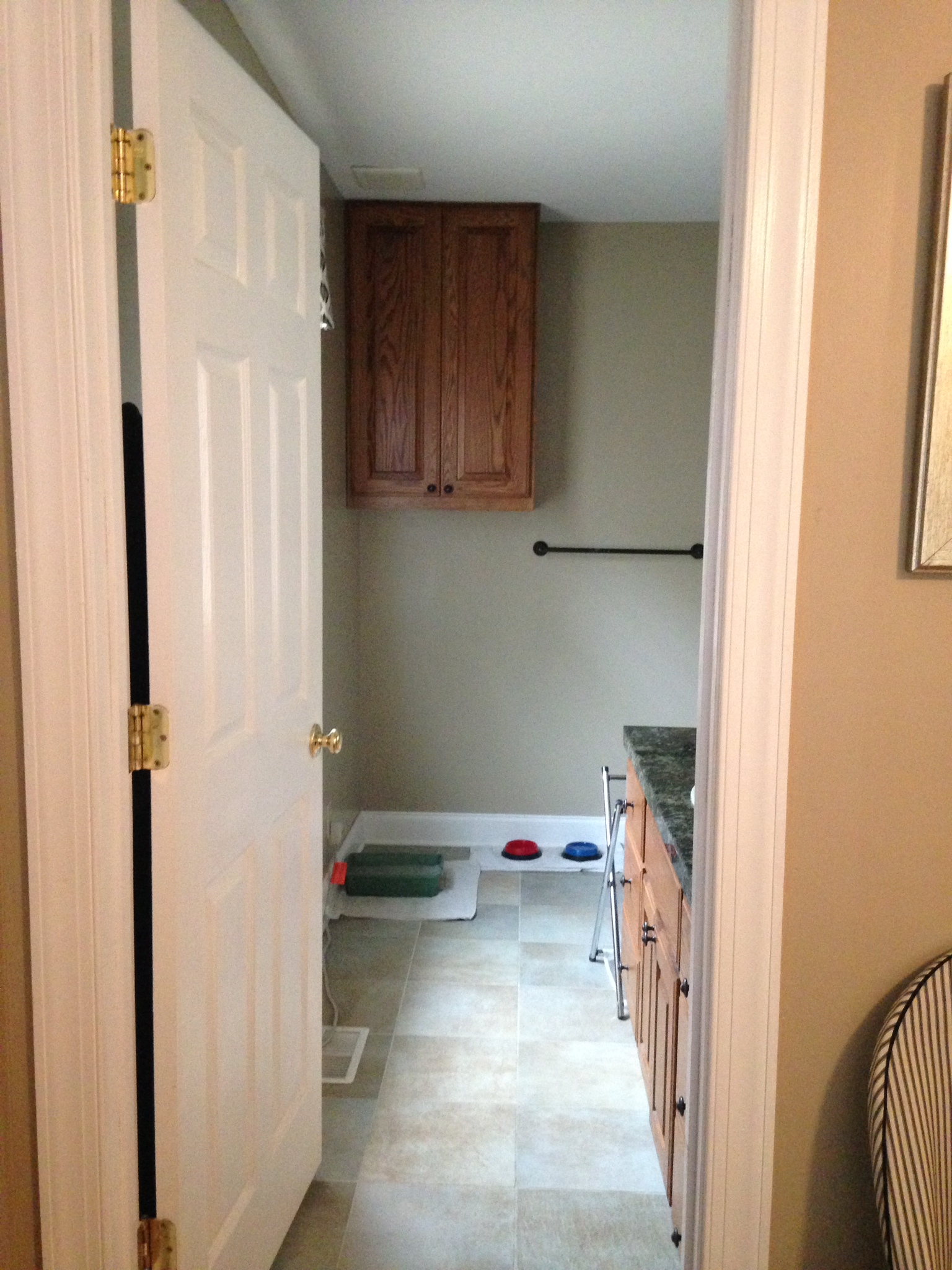  Since our cat, Heidi, adopted us last month, her bowls and litter box have taken over our bathroom. There has got to be a better, more visually pleasing solution for her little space. 