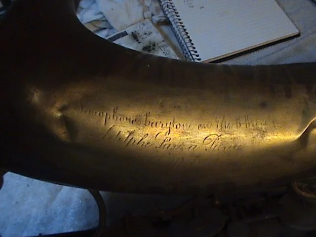 07-BarnardRepair_AdolpheSax-Baritone-BellEngraving_before.jpg