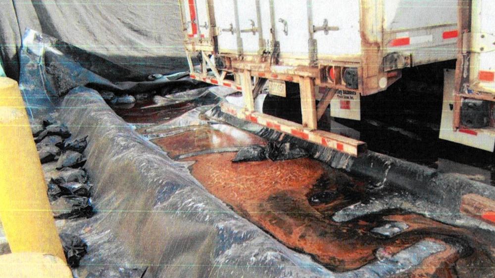 After an October 2013 inspection by the California Department of Toxic Substances Control, regulators wrote that "Water which leaked from the 40-foot trailers appeared to puddle over a period of time." (California Department of Toxic Substances Control)