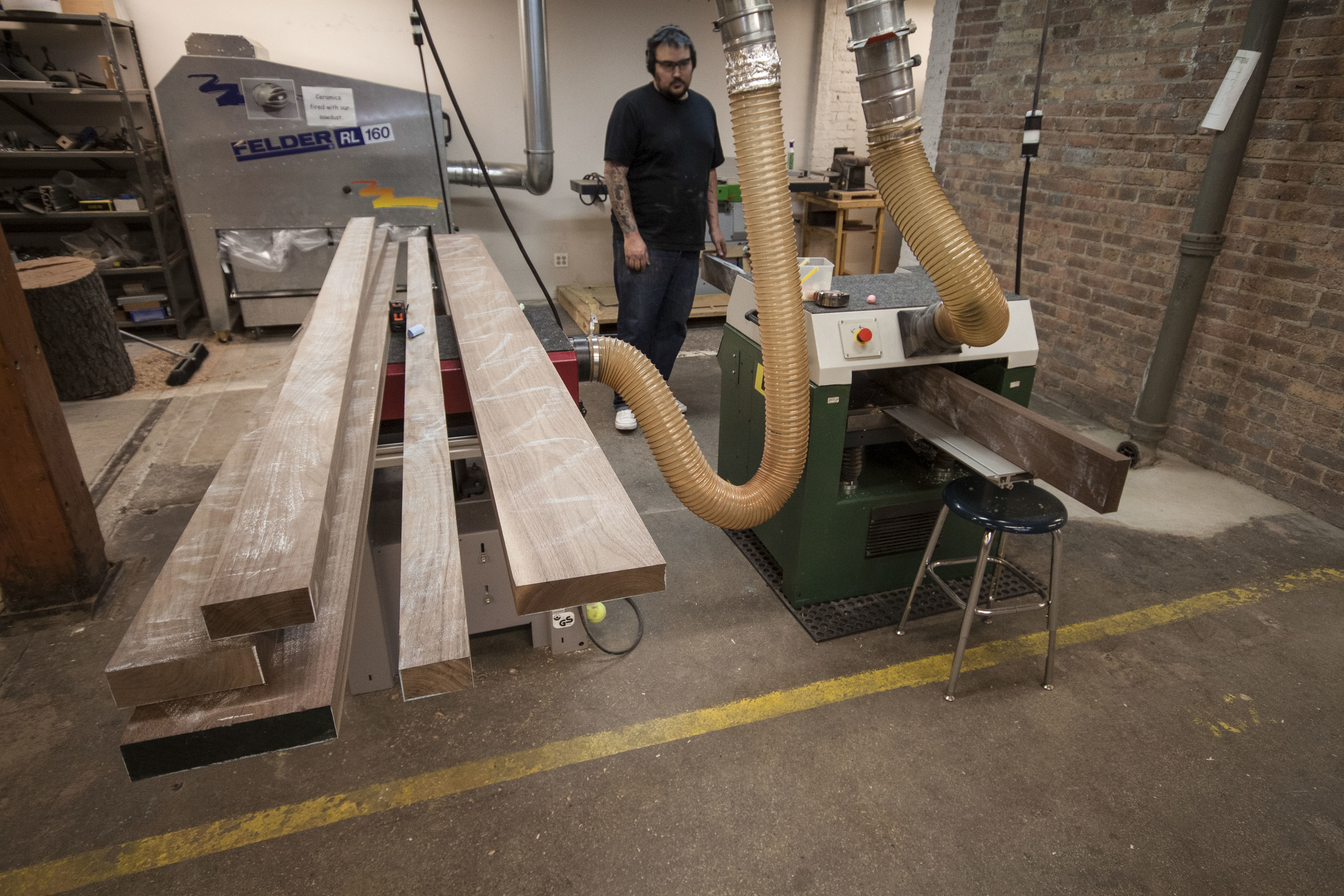 Planing, jointing, and ripping to size. Squaring up raw material is a large part of woodworking, and it's hard work. This is at the Chicago School of Woodworking in Lincoln Square.