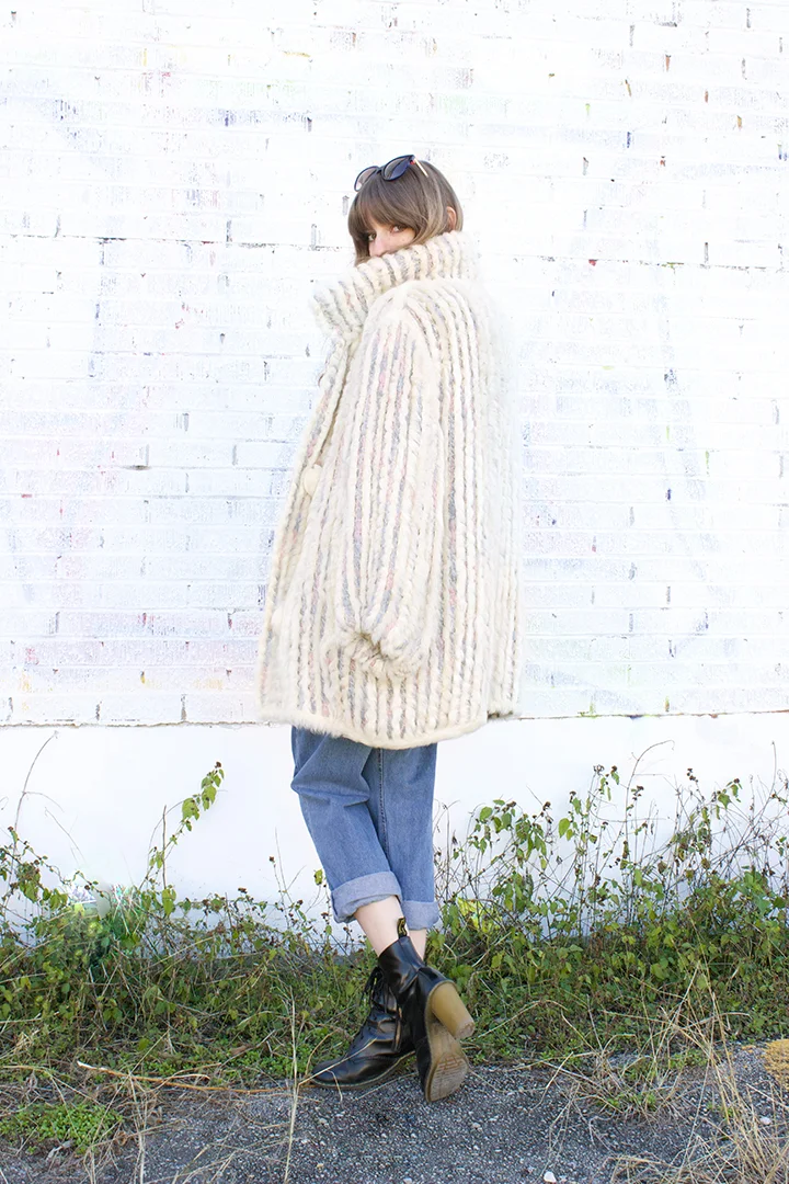 Alex wears this perfect vintage 80s shearling and yarn sweater coat - Size large - $150, Thierry Lasry "Flashy" sunglasses for $435 and ring by Unearthen , size 7 - $375. To purchase, just give us a call!