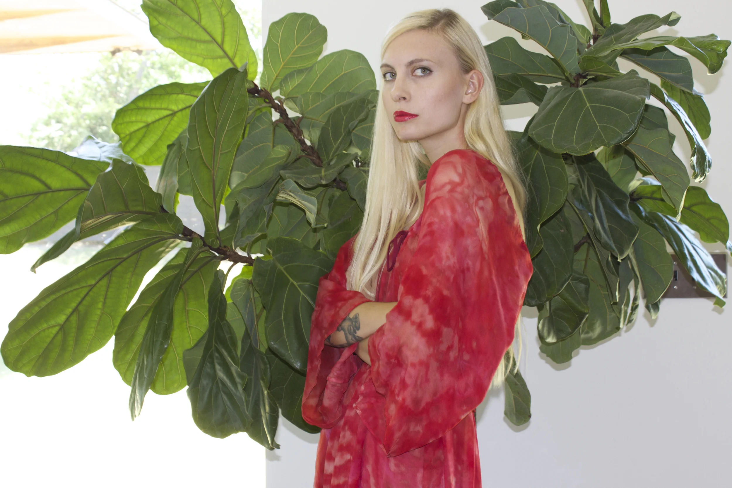 We are so in love with this 1970s hand-dyed red silk dress! To shop it, click here . Model Rachel Baker. Photography Katy Shayne . Styling Masha Poloskova.