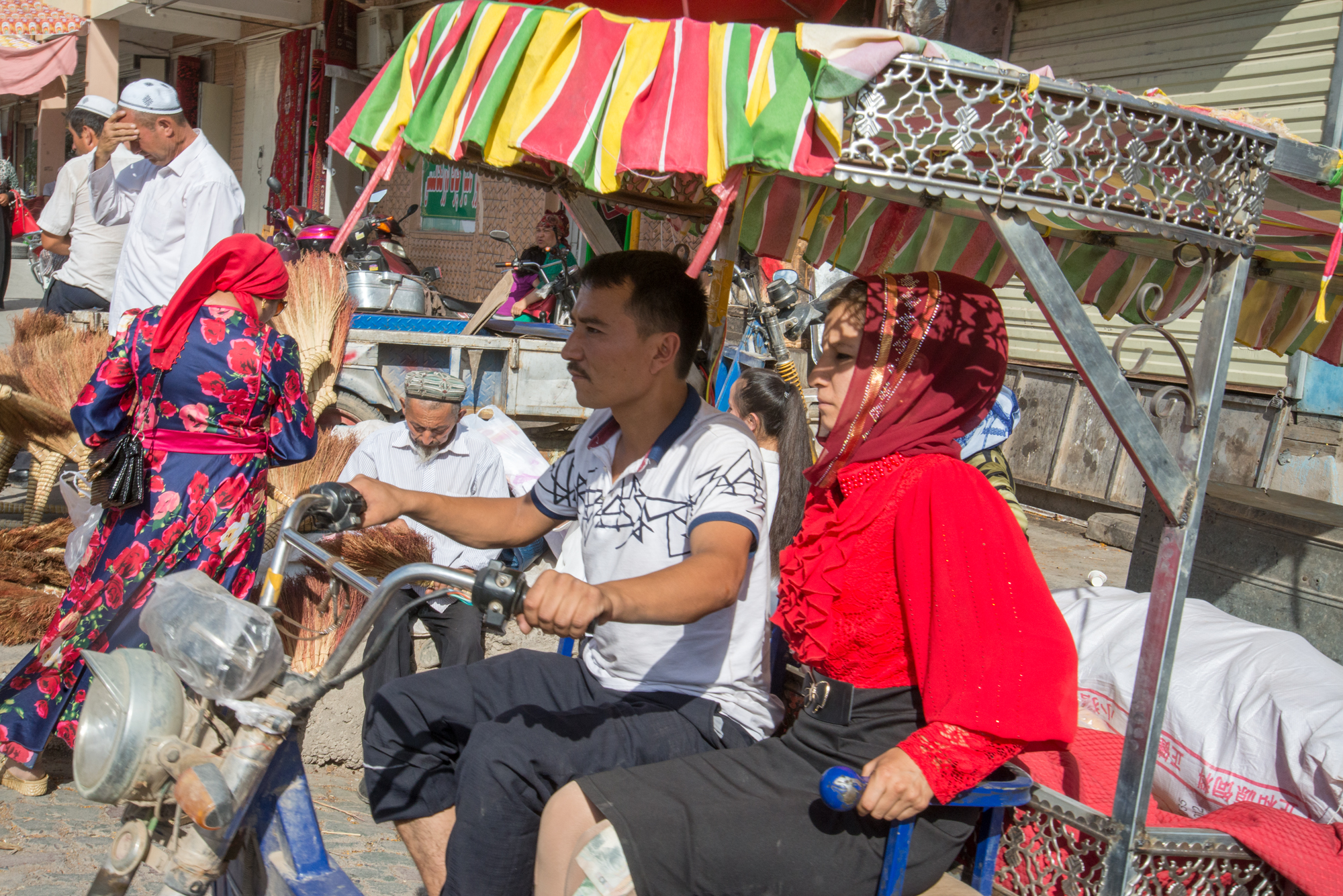 Uyghur Couple on Motorcycle Truck