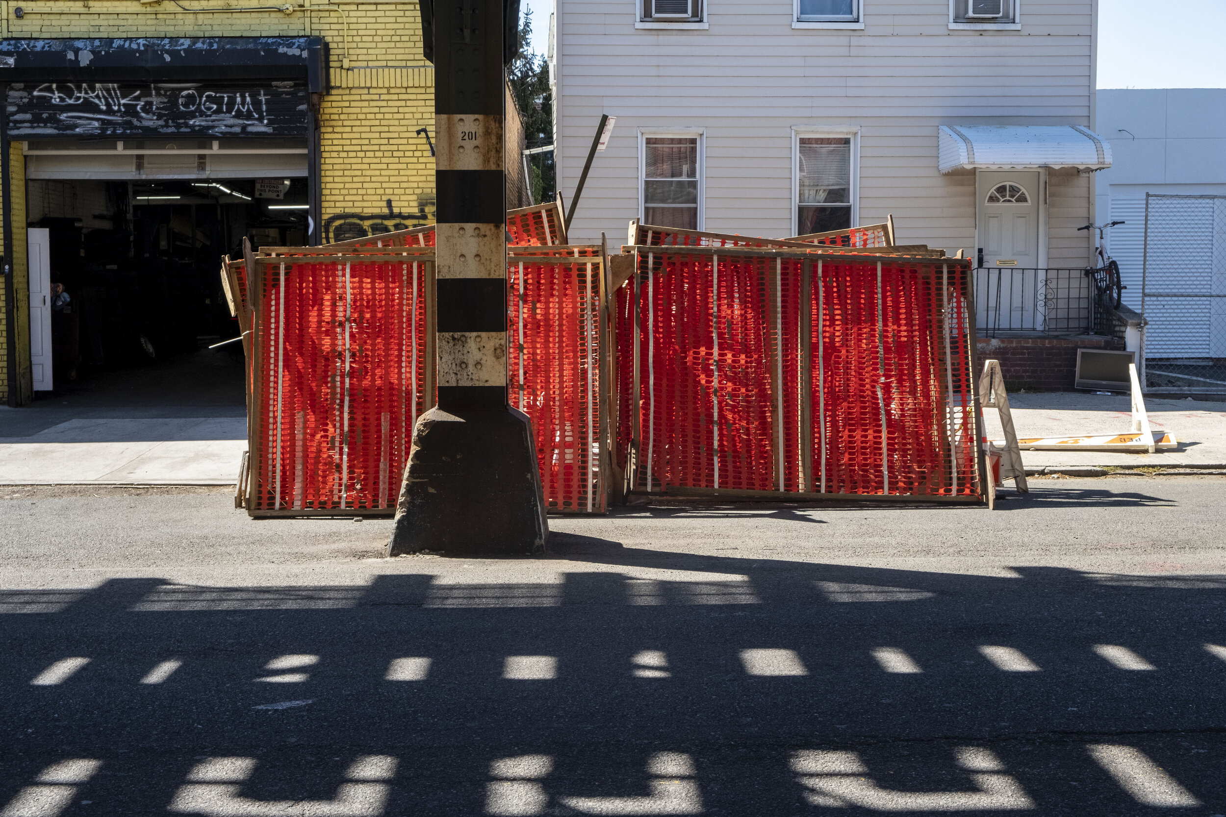 red fence under elevated.jpg