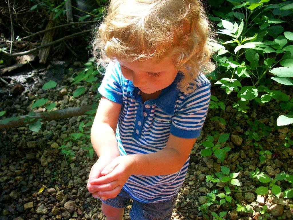 girl holding frog.jpg
