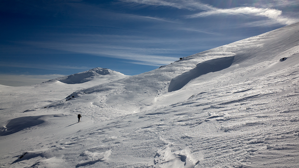 A sketchy icy and very steep traverse under a cornice. 