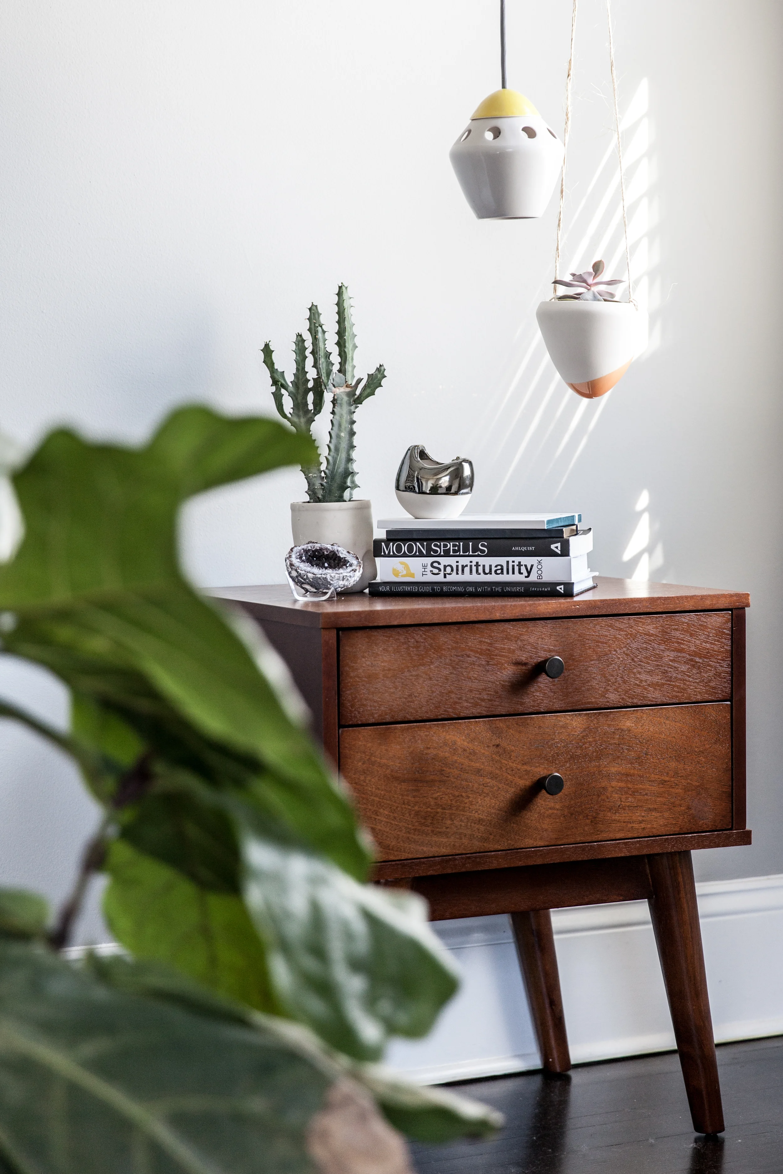 This side table got a dreamy set up with the ‘ Stamper ’ succulent planter, ‘ Garden Bomb ’ hanging succulent planter, ‘ Choir ’ votive, and small ‘ Rocket ’ pendant light.