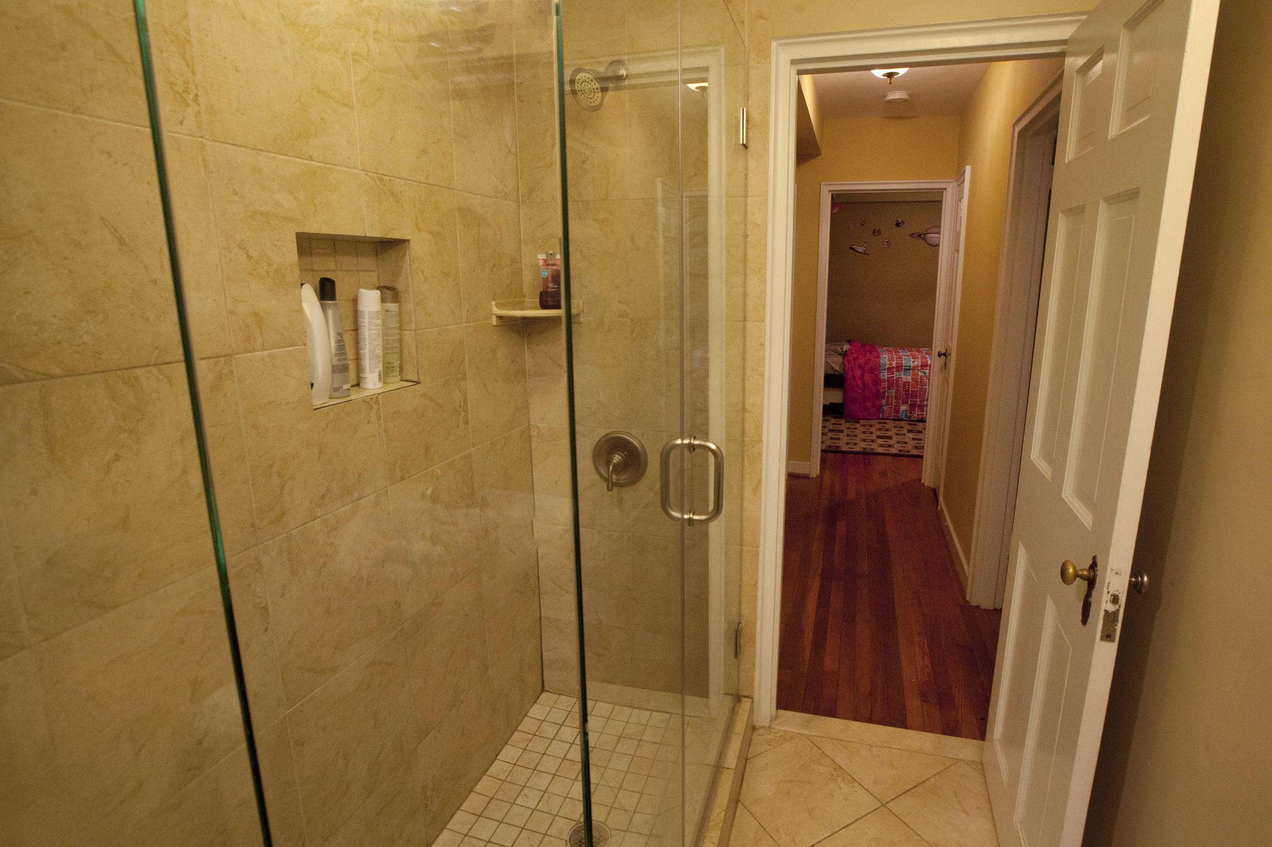 Glass shower makes the most use of the space.