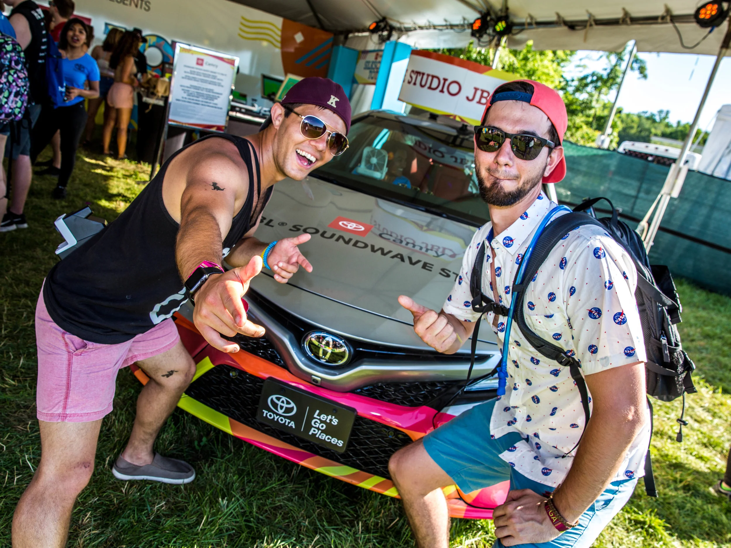 two men in front of the car.jpg