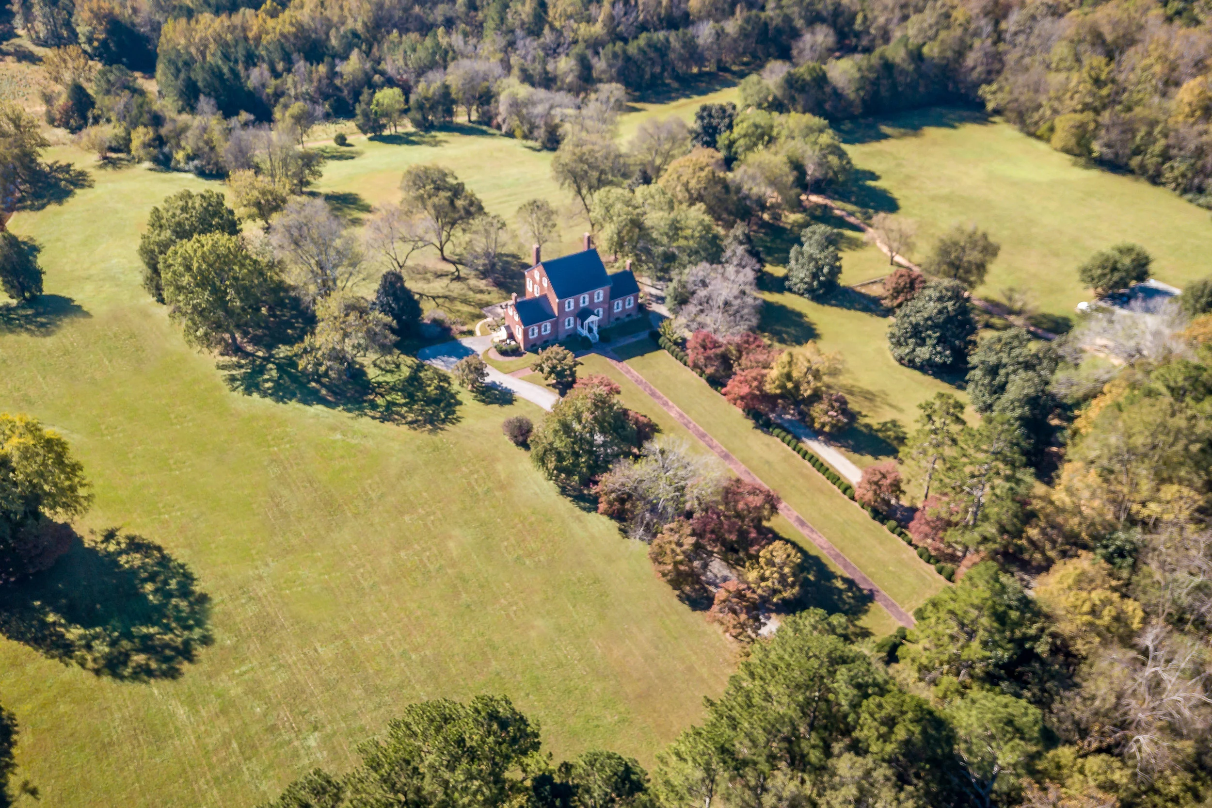 Show off a house and its landscaping.