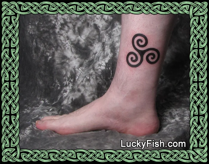 Celtic triskele tattoo by Pat Fish