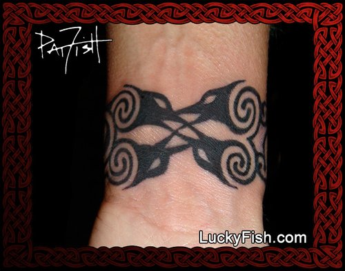 Timeless Elegance Meets Raw Power: The Tribal Dragon Tattoo — LuckyFish,  Inc. and Tattoo Santa Barbara