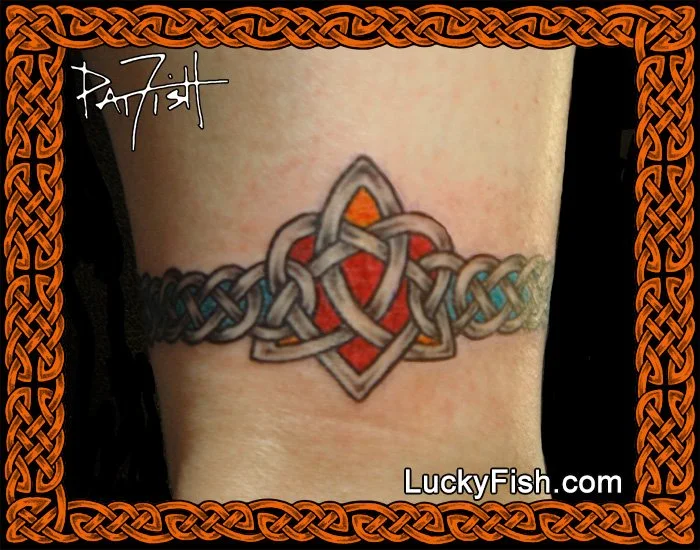 Celtic Heart Tattoo Band with Triskle Design