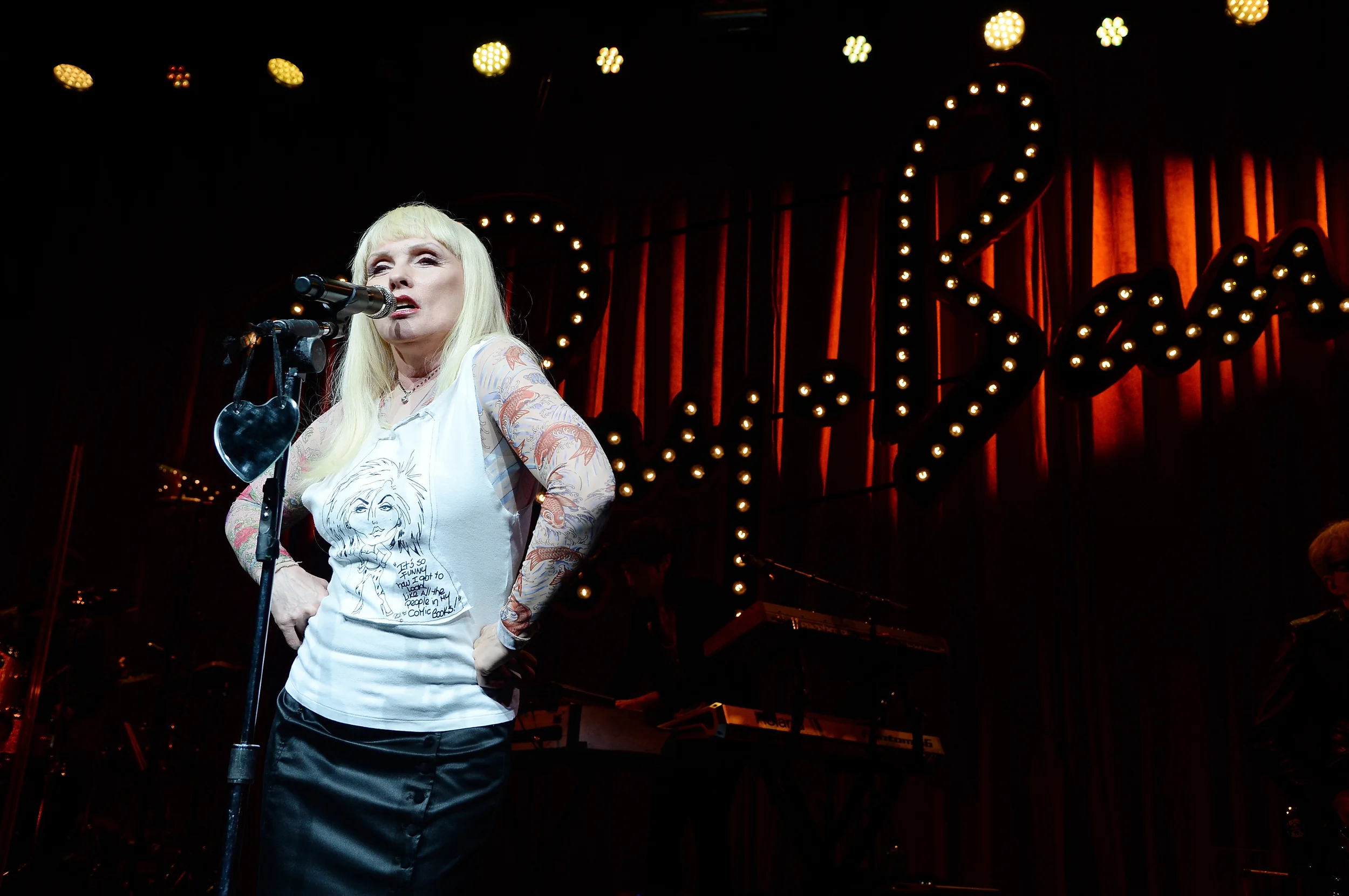  Debbie Harry performing in front of a custom built Ray-Ban sign. 