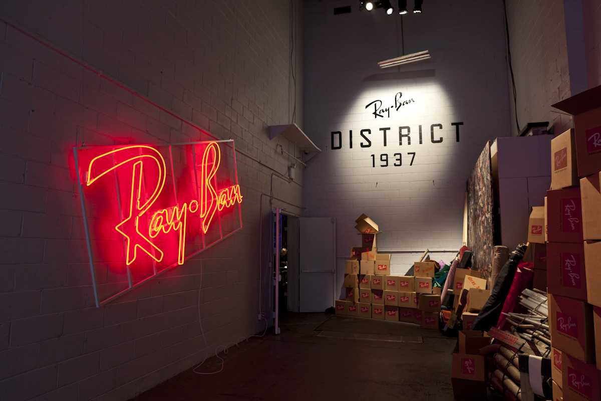 Guests entered the event through the loading dock and were greeted with a large neon logo, a vinyl decal lockup, branded boxes, fly-posted campaign imagery, and the five materials that the new line is crafted from. 'District 1937' font is a cus