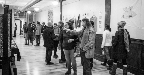 Abby Deneau and Aaron Lee Van Wyk, both participating artists in "Utilitarian State" during Free Radical 2014, discuss his bio-diesel fueled art fireplace.