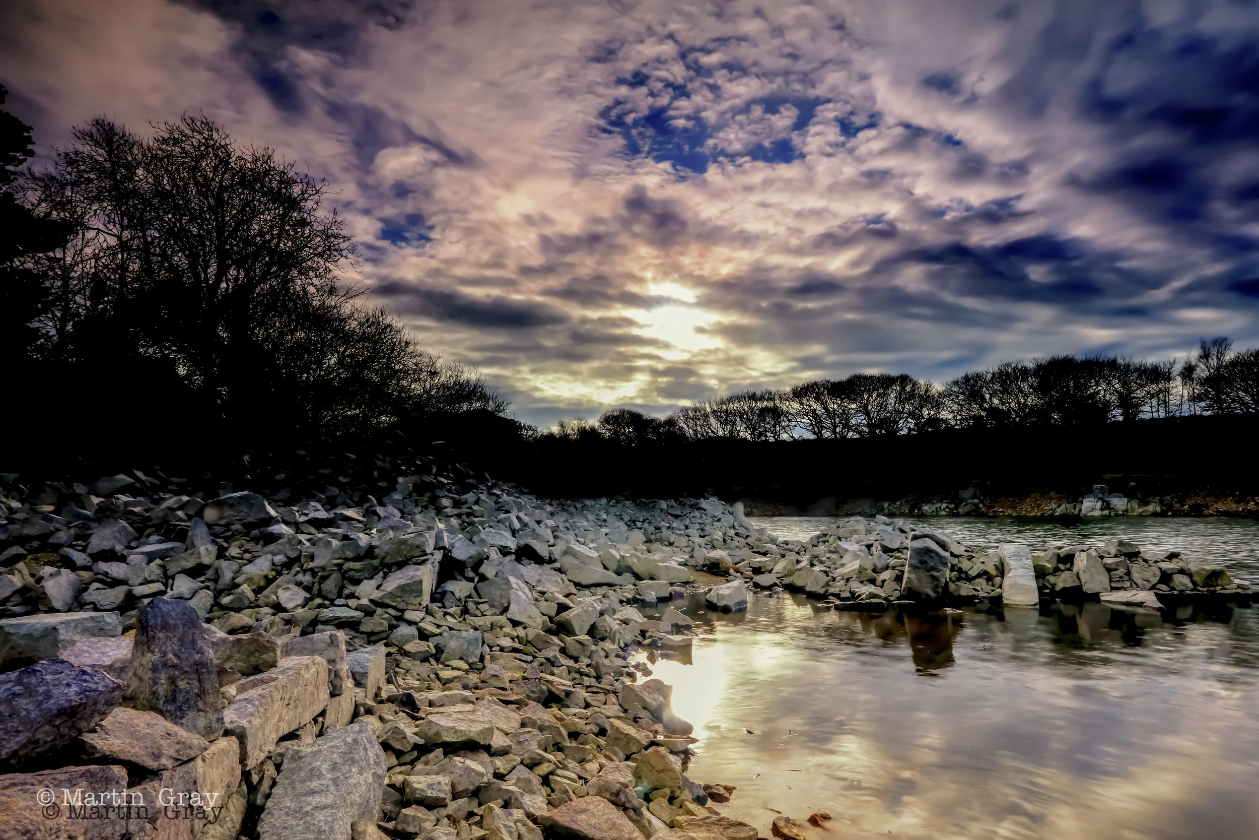 'The changing of sunlight to moonlight'... Guernsey's Reservoir before the sun sets...