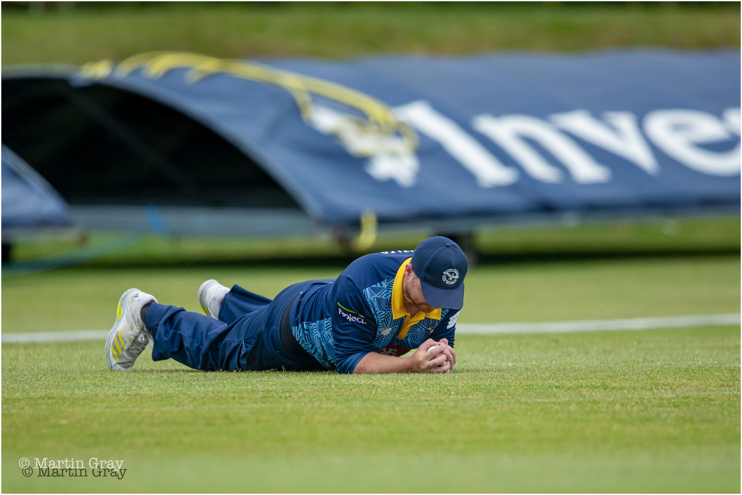 Josh Butler holds on to a stunning low catch on the boundary to dismiss Ed Robinson-5431.jpg