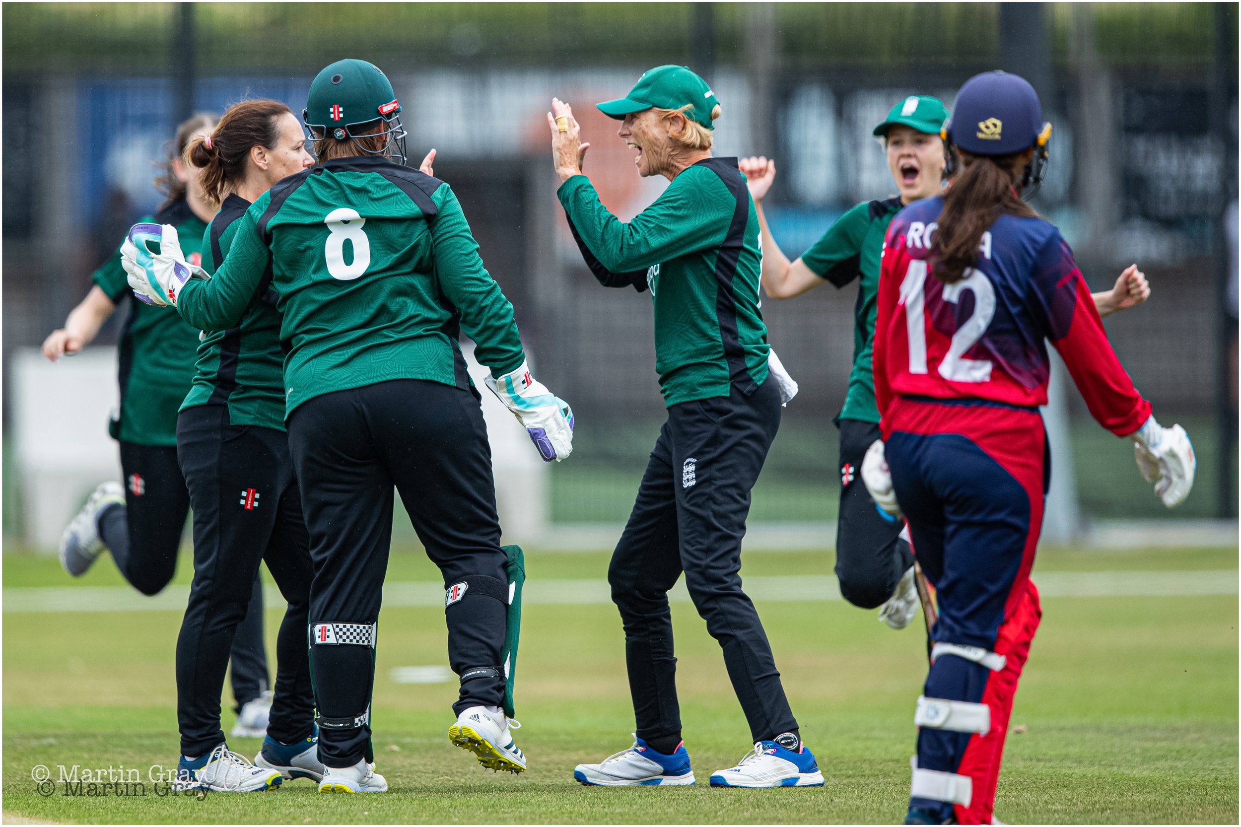 Guernsey high five the opening wicket of Maria Da Rocha-4016.jpg