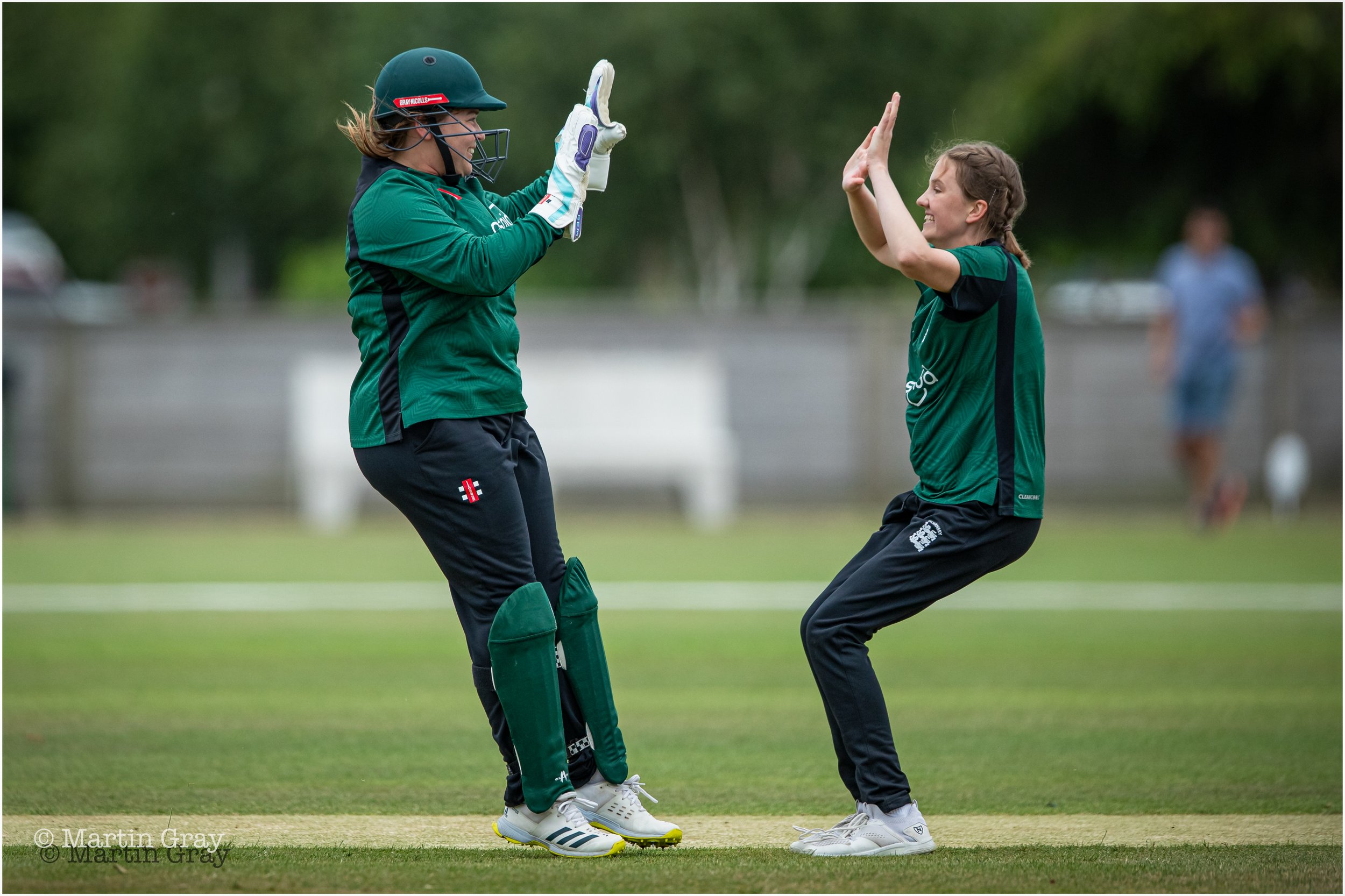 Molly Robinson celebrates with Krista De La Mare a wicket in her first over-4260.jpg