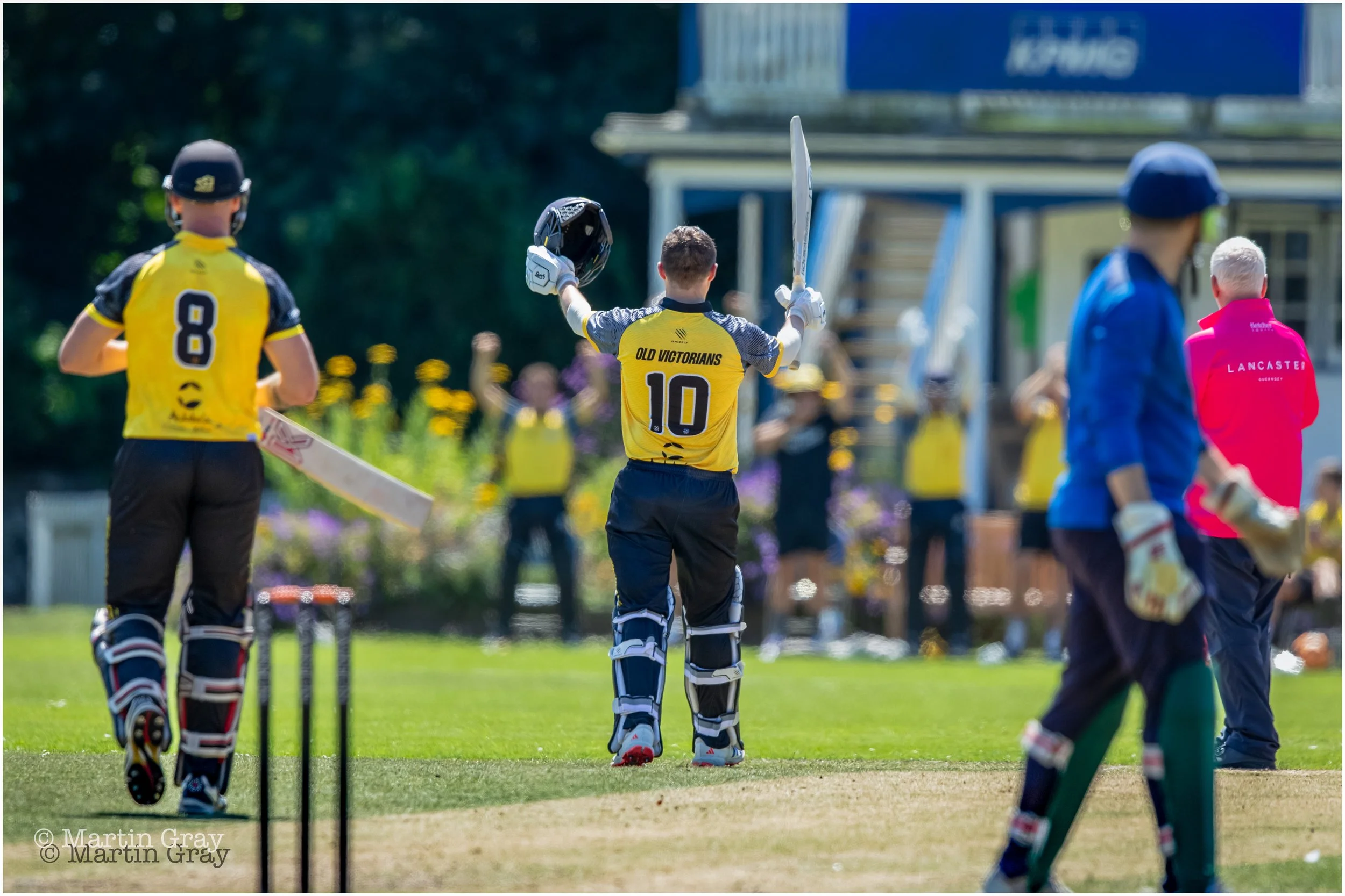 James Duckett raises his bat toward his team-mates on reaching his century-0066.jpg
